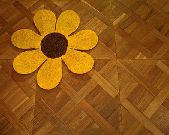 Pavimento mosaik listelli di legno intrecciati